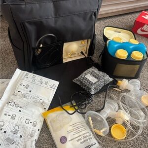 Used Medela Breast Pump On The Go With Tote  & accessories